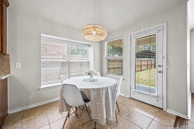 26430 Walden Oak, San Antonio, TX 78260 - dining room featuring baseboards, light tile patterned flooring, a chandelier, and a textured wall