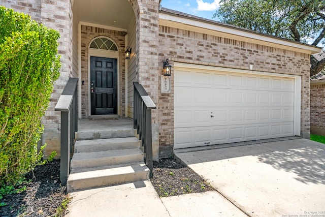 26430 Walden Oak, San Antonio, TX 78260 - entrance to property with brick siding, driveway, and a garage