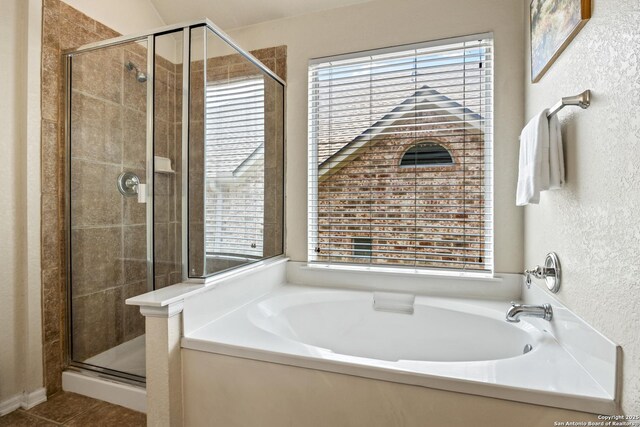 26430 Walden Oak, San Antonio, TX 78260 - full bathroom with a shower stall, healthy amount of natural light, a textured wall, and a garden tub