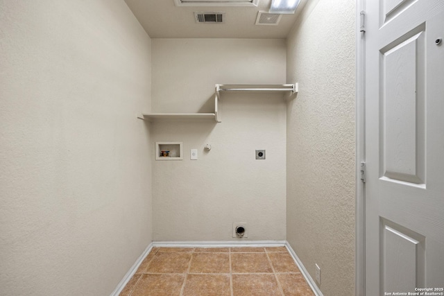 26430 Walden Oak, San Antonio, TX 78260 - laundry room featuring hookup for an electric dryer, gas dryer hookup, baseboards, hookup for a washing machine, and tile patterned floors