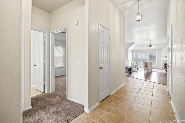 26430 Walden Oak, San Antonio, TX 78260 - corridor featuring a textured wall, light tile patterned floors, and baseboards