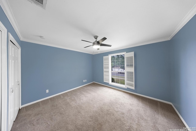 2611 Eisenhauer Unit 104A, San Antonio, TX 78209 - unfurnished bedroom with carpet flooring, crown molding, baseboards, a closet, and a ceiling fan