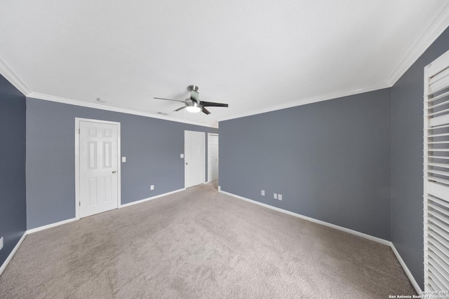 2611 Eisenhauer Unit 104A, San Antonio, TX 78209 - unfurnished bedroom with carpet, baseboards, crown molding, and a ceiling fan