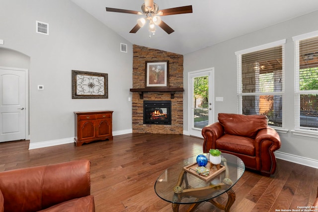 7635 Paraiso Crst, Boerne, TX 78015 - living room featuring ceiling fan, a fireplace, wood finished floors, baseboards, and arched walkways