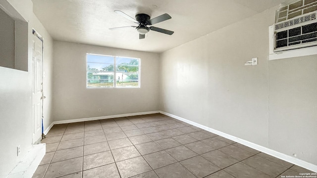 103 Pollydale Ave, San Antonio, TX 78223 - spare room featuring light tile patterned floors, ceiling fan, a wall mounted air conditioner, and baseboards