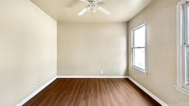 103 Pollydale Ave, San Antonio, TX 78223 - spare room featuring healthy amount of natural light, baseboards, dark wood finished floors, and ceiling fan