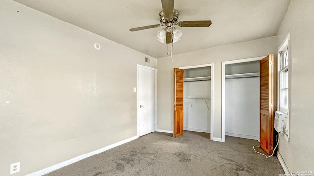 103 Pollydale Ave, San Antonio, TX 78223 - unfurnished bedroom featuring two closets, carpet, baseboards, and a ceiling fan