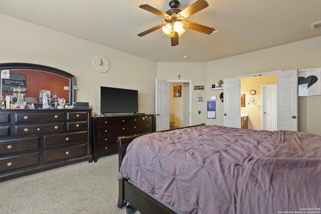 738 Daisy Xing, San Antonio, TX 78245 - bedroom featuring carpet floors, ceiling fan, and ensuite bath