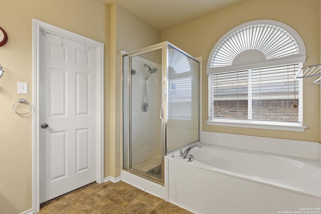 738 Daisy Xing, San Antonio, TX 78245 - full bath featuring a stall shower, a garden tub, and baseboards
