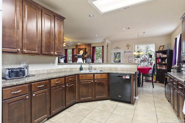 738 Daisy Xing, San Antonio, TX 78245 - kitchen with dishwasher, a sink, a peninsula, light tile patterned floors, and light stone countertops