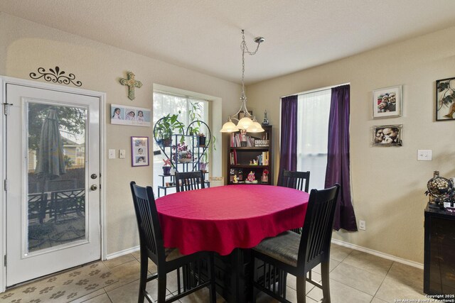 738 Daisy Xing, San Antonio, TX 78245 - dining space with light tile patterned floors and baseboards