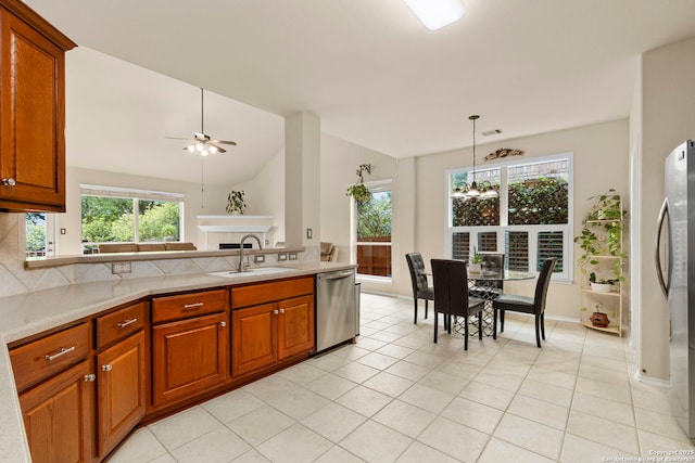 26223 Cuyahoga Cir, San Antonio, TX 78260 - kitchen with stainless steel appliances, a sink, ceiling fan, light countertops, and vaulted ceiling