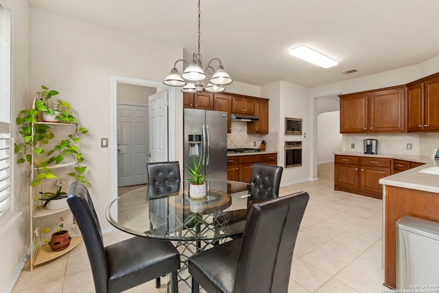 26223 Cuyahoga Cir, San Antonio, TX 78260 - dining area featuring a chandelier and light tile patterned floors