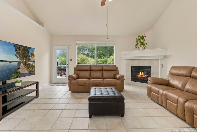 26223 Cuyahoga Cir, San Antonio, TX 78260 - living room with vaulted ceiling, light tile patterned floors, a tile fireplace, and ceiling fan