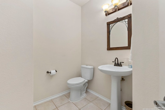 26223 Cuyahoga Cir, San Antonio, TX 78260 - bathroom with tile patterned floors, toilet, baseboards, and a sink