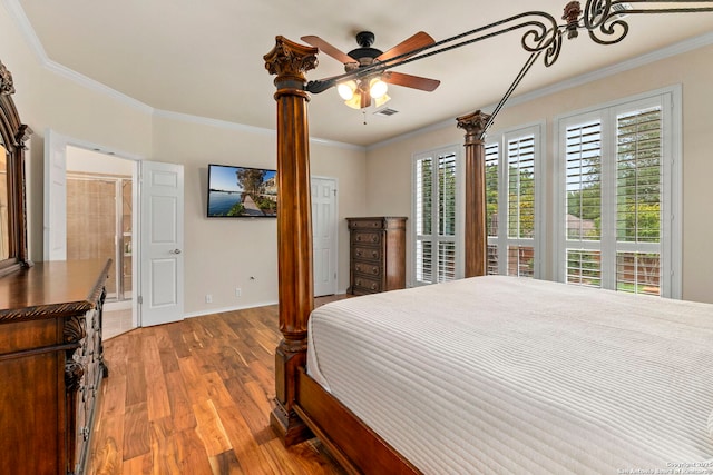 26223 Cuyahoga Cir, San Antonio, TX 78260 - bedroom featuring wood finished floors, ornamental molding, baseboards, and ensuite bath