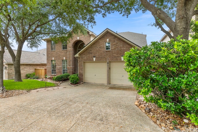 26223 Cuyahoga Cir, San Antonio, TX 78260 - traditional-style home featuring brick siding, concrete driveway, a garage, and roof with shingles