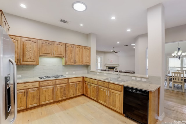 154 Roseheart, San Antonio, TX 78259 - kitchen featuring a sink, dishwasher, gas cooktop, light wood-type flooring, and decorative backsplash