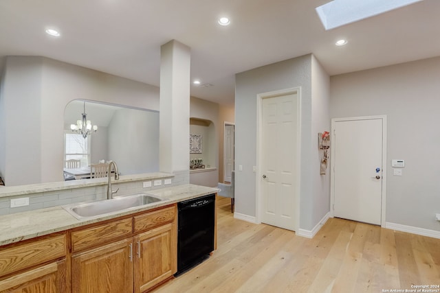 154 Roseheart, San Antonio, TX 78259 - kitchen featuring black dishwasher, a sink, light wood-type flooring, tasteful backsplash, and a chandelier