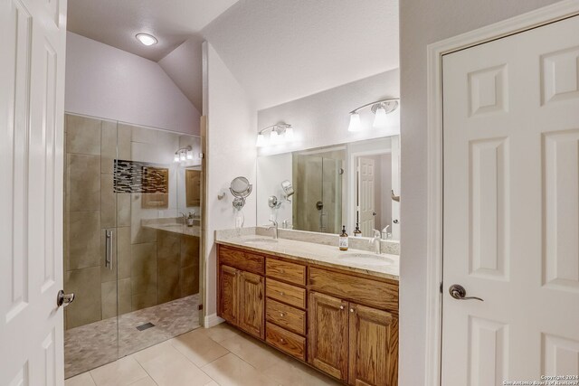 154 Roseheart, San Antonio, TX 78259 - bathroom with a shower stall, double vanity, tile patterned floors, and vaulted ceiling