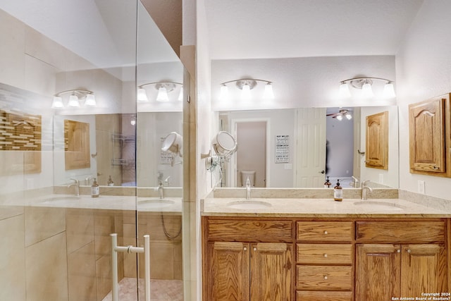 154 Roseheart, San Antonio, TX 78259 - full bathroom featuring a shower stall, toilet, double vanity, and a ceiling fan