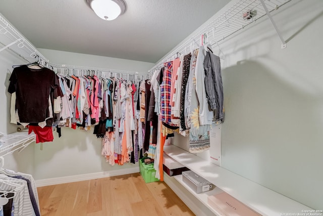 154 Roseheart, San Antonio, TX 78259 - walk in closet with wood finished floors
