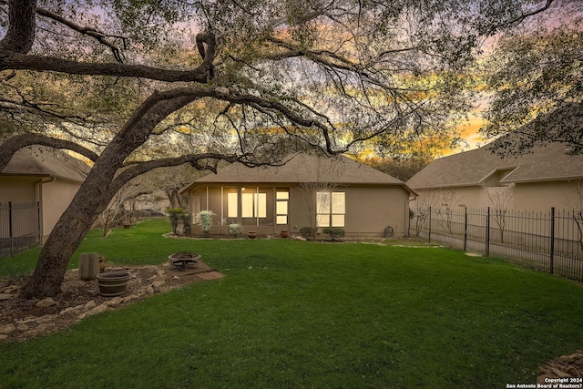 154 Roseheart, San Antonio, TX 78259 - back of property at dusk with stucco siding