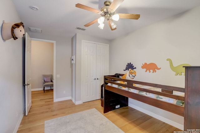 154 Roseheart, San Antonio, TX 78259 - bedroom featuring light wood-style flooring, baseboards, a closet, and a ceiling fan