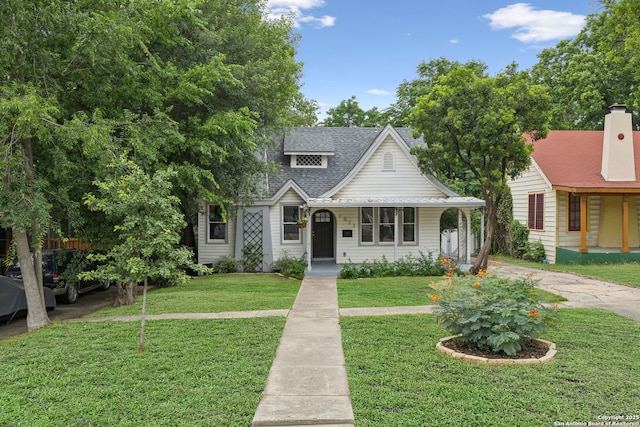 1023 Gramercy, San Antonio, TX 78201 - view of front of property with a front yard, a porch, and roof with shingles