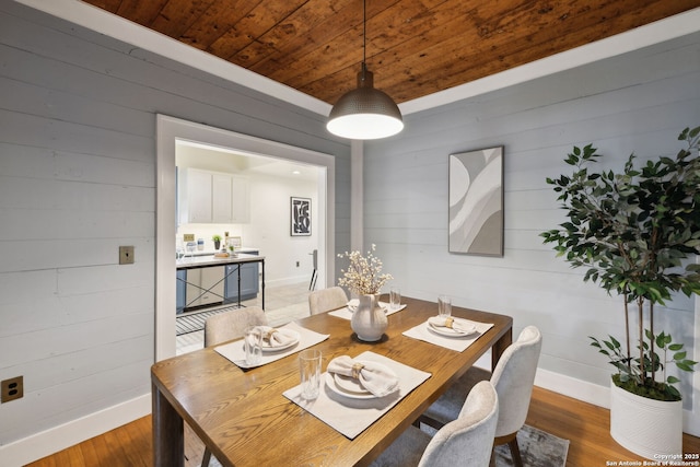1023 Gramercy, San Antonio, TX 78201 - dining room with wood finished floors, wooden walls, baseboards, and wooden ceiling