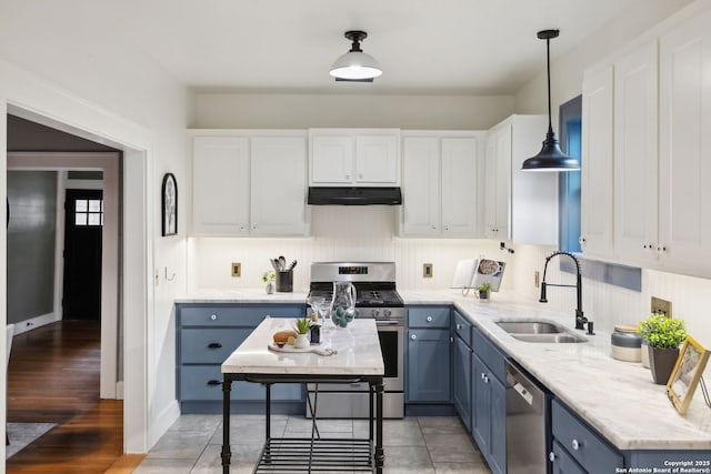 1023 Gramercy, San Antonio, TX 78201 - kitchen featuring stainless steel appliances, a sink, under cabinet range hood, white cabinets, and blue cabinets