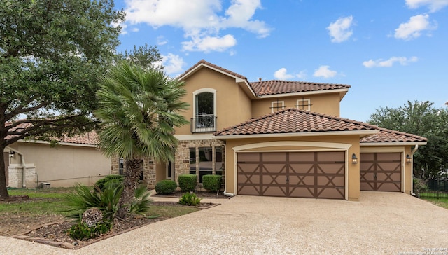 1238 Via Belcanto, San Antonio, TX 78260 - mediterranean / spanish-style home with a garage, driveway, stucco siding, and a tile roof