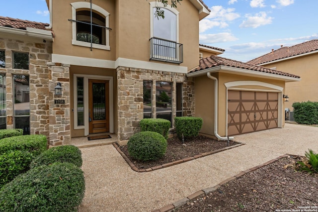 1238 Via Belcanto, San Antonio, TX 78260 - view of exterior entry featuring stone siding, stucco siding, a balcony, and a tile roof