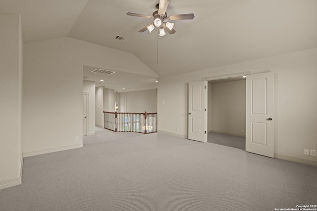 1238 Via Belcanto, San Antonio, TX 78260 - spare room with vaulted ceiling, ceiling fan, baseboards, and carpet