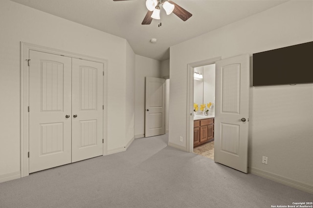 1238 Via Belcanto, San Antonio, TX 78260 - unfurnished bedroom featuring light colored carpet, a closet, baseboards, ensuite bathroom, and ceiling fan