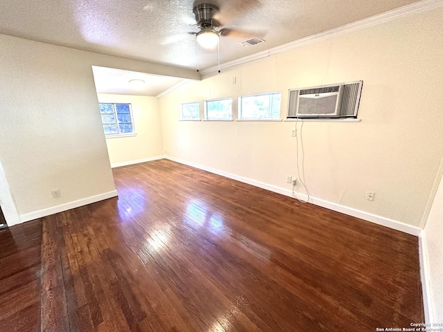 207 Freiling, San Antonio, TX 78213 - spare room featuring a ceiling fan, wood finished floors, a textured ceiling, a wall unit AC, and baseboards