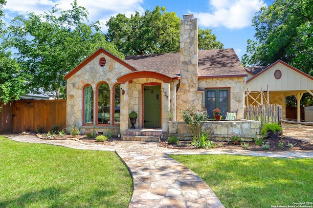129 E Evergreen, Boerne, TX 78006 - view of front of property with stone siding, roof with shingles, and a chimney