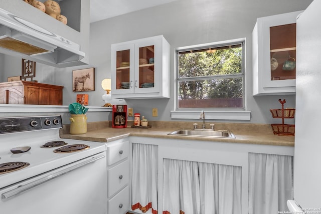 129 E Evergreen, Boerne, TX 78006 - kitchen featuring electric range, a sink, white cabinets, and light countertops