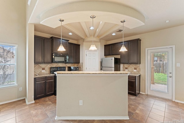 8903 Derby Dan, Converse, TX 78109 - kitchen with freestanding refrigerator, black microwave, electric range, dark brown cabinetry, and recessed lighting