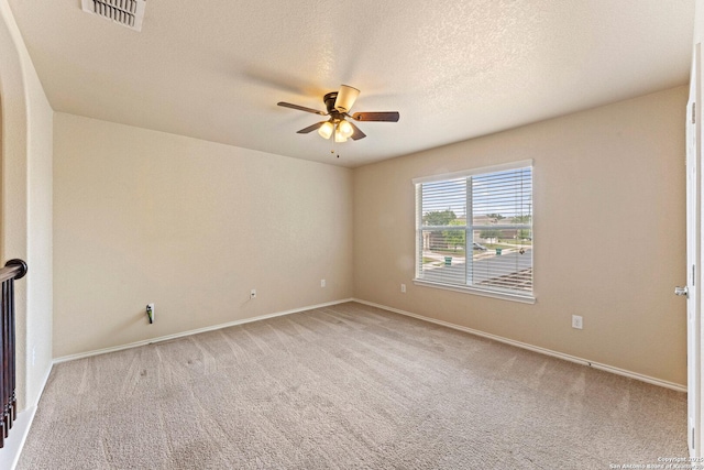 8903 Derby Dan, Converse, TX 78109 - spare room featuring ceiling fan, carpet floors, baseboards, and a textured ceiling