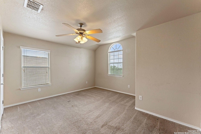 8903 Derby Dan, Converse, TX 78109 - unfurnished room featuring ceiling fan, carpet, baseboards, a textured ceiling, and lofted ceiling