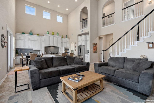 17906 Via Del Arbol, San Antonio, TX 78257 - living area featuring a high ceiling, recessed lighting, stairs, and baseboards