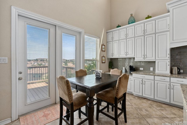 17906 Via Del Arbol, San Antonio, TX 78257 - dining space featuring light tile patterned floors and a towering ceiling