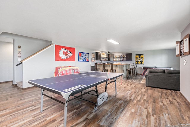 17906 Via Del Arbol, San Antonio, TX 78257 - rec room with bar, wood finished floors, and baseboards