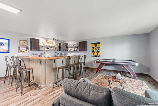 17906 Via Del Arbol, San Antonio, TX 78257 - indoor bar featuring light wood-type flooring and baseboards