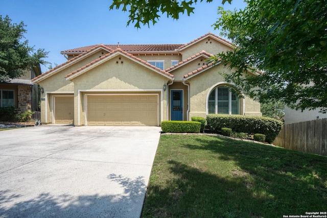 17906 Via Del Arbol, San Antonio, TX 78257 - mediterranean / spanish house featuring an attached garage, stucco siding, a tile roof, and concrete driveway