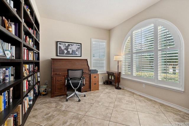 17906 Via Del Arbol, San Antonio, TX 78257 - office featuring light tile patterned floors, baseboards, and wall of books