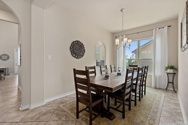 17906 Via Del Arbol, San Antonio, TX 78257 - dining area featuring arched walkways, a chandelier, and baseboards