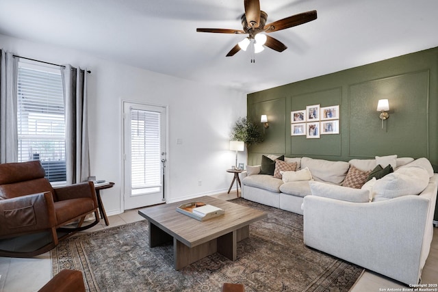 5219 Wolf Bane, San Antonio, TX 78261 - living room featuring ceiling fan and a decorative wall