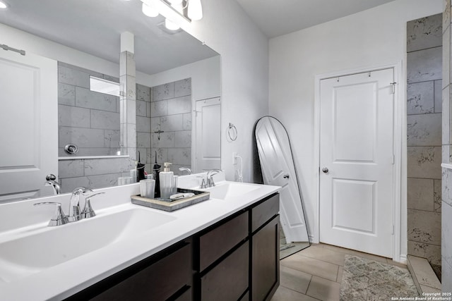 5219 Wolf Bane, San Antonio, TX 78261 - bathroom with double vanity, tile patterned flooring, and a tile shower